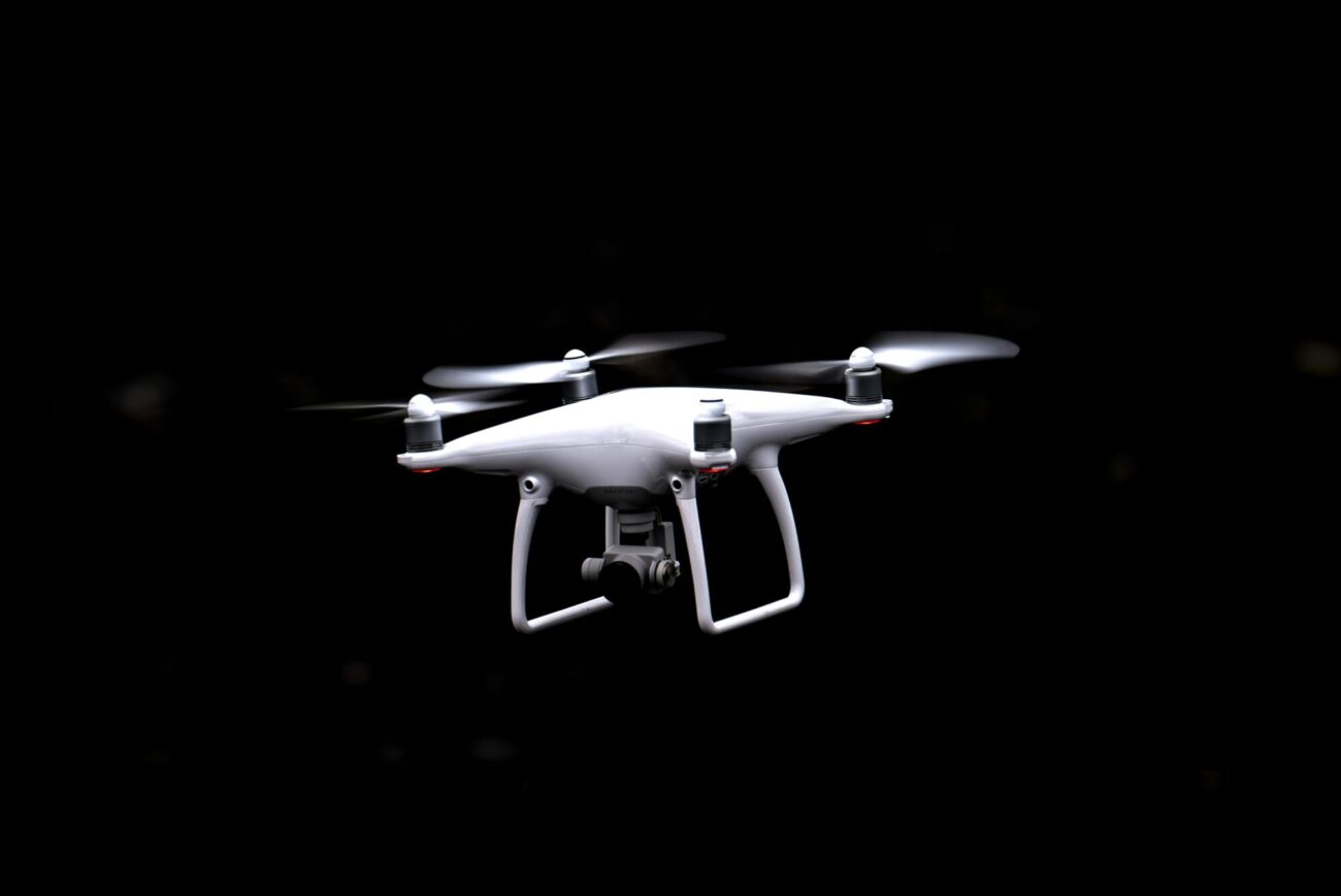 white and black quadcopter drone